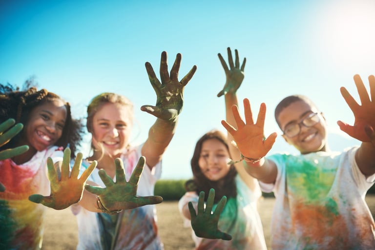 Children getting their hands dirty and having a great time together outdoors